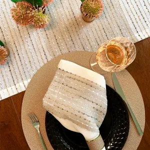 Bodrum Odyssey napkins and runners with metallic confetti accents